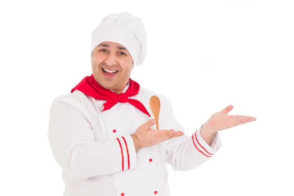 Feliz chef mostrando algo vistiendo uniforme rojo y blanco — Foto de Stock