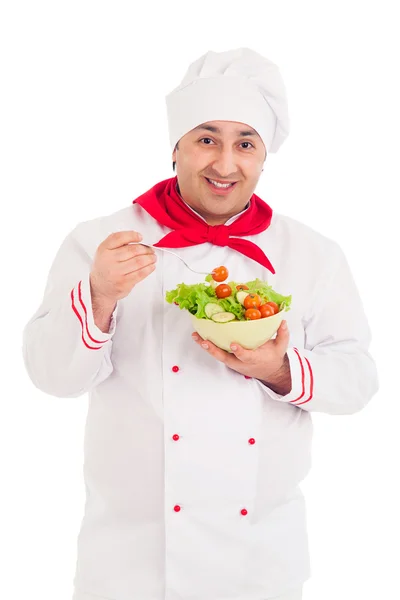 Chef holding dish with salad and fresh vegetables wearing red — Stock Photo, Image