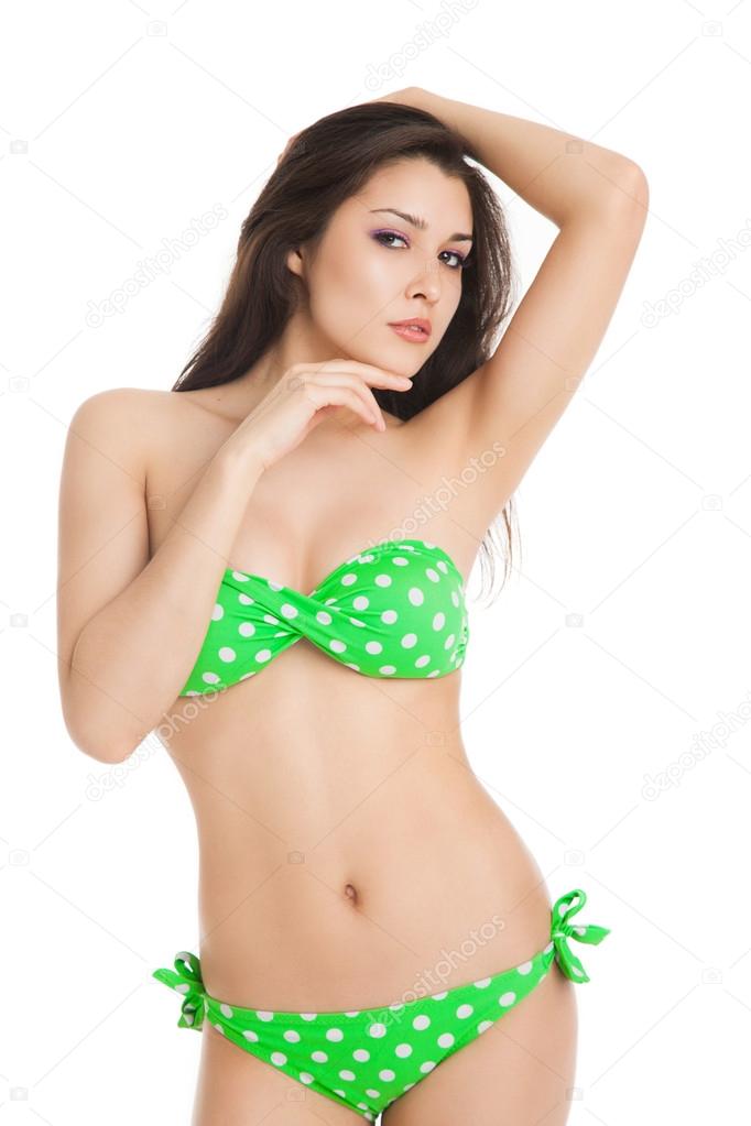 sexy brunette girl wearing green swimsuit