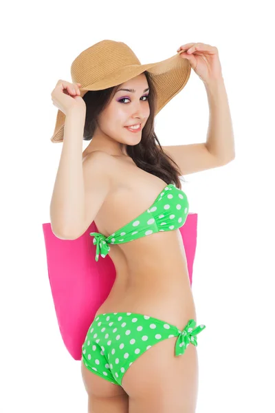 Sexy young brunette girl wearing green swimsuit and big hat, ho — Stockfoto