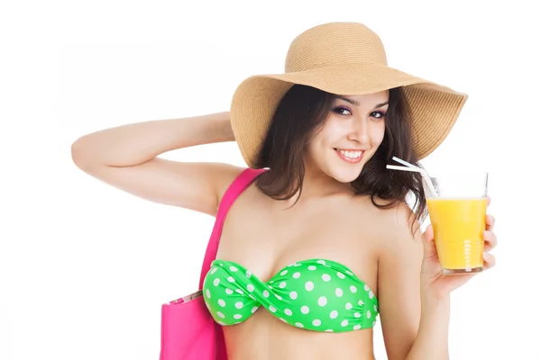 Ragazza bruna in costume da bagno verde e cappello, con un bicchiere di arancione — Foto Stock
