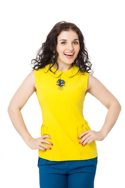 Happy brunette girl with curly hair wearing yellow blouse and bl — Stock Photo, Image