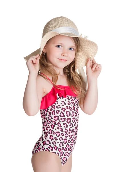 Kleines blondes, glückliches Mädchen im rosa Badeanzug mit Hut lizenzfreie Stockfotos