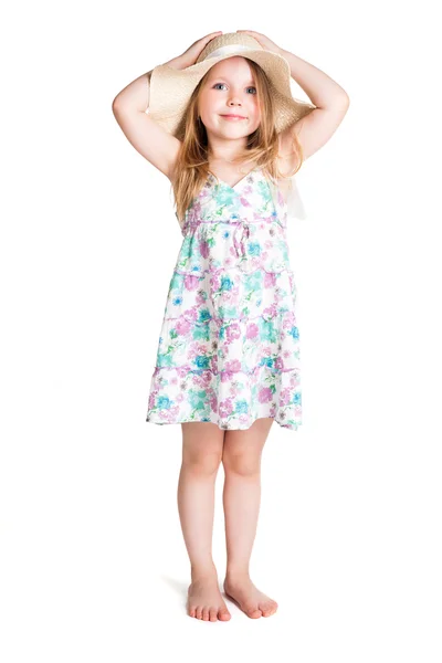 Smiling little blonde girl wearing big white hat and dress — Stock Photo, Image