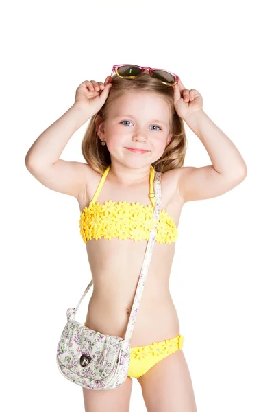 Little blonde girl wearing swimsuit, sun glasses and bag — Stock Photo, Image