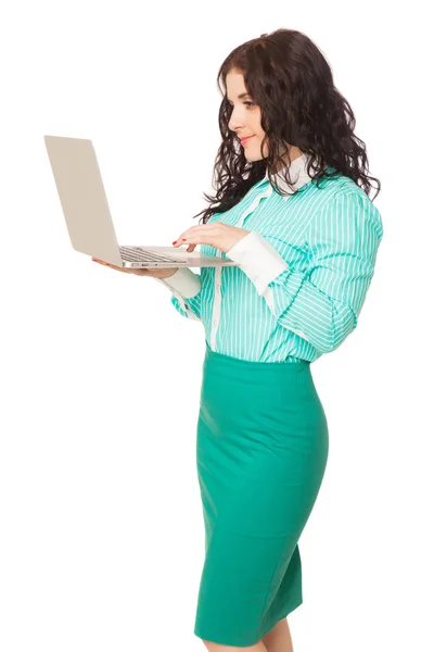 Slim beautiful brunette girl in green skirt and blouse holding l — Stock Photo, Image