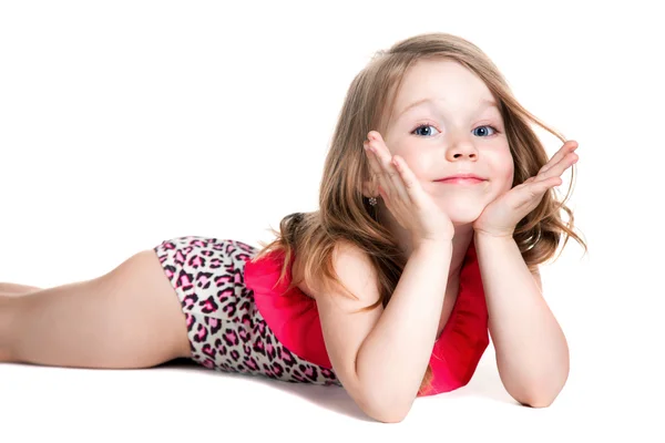 Little blonde happy girl in pink swimsuit lying on the floor — Stock Photo, Image