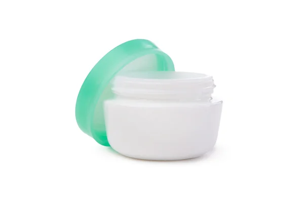 Envase cosmético de crema facial abierto con tapa verde — Foto de Stock