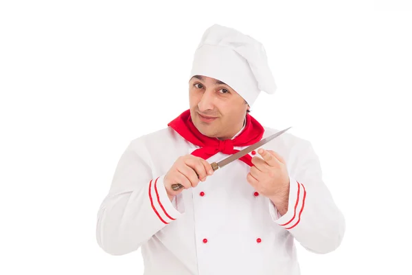 Chef holding knife wearing red and white uniform — Stock Photo, Image