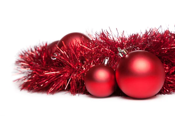 Two christmas tree toys with red garland — Stock Photo, Image
