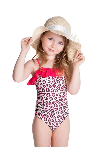 Little blonde happy girl in pink swimsuit holding hat — Stock Photo, Image