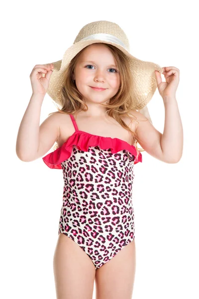 Pequena loira feliz menina em rosa maiô segurando chapéu — Fotografia de Stock