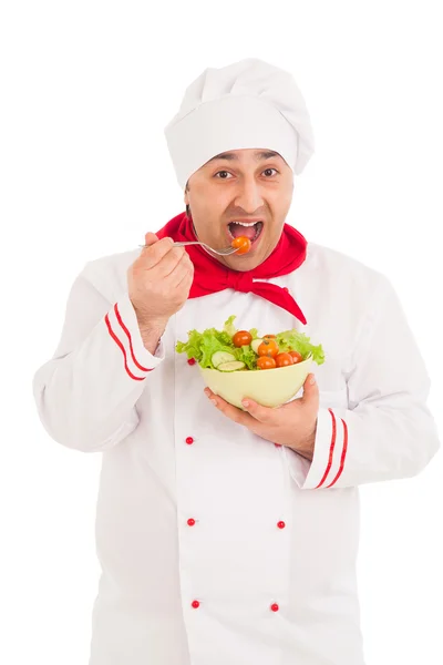 Chef  holding dish with salad and fresh vegetables  wearing red — Stock Photo, Image