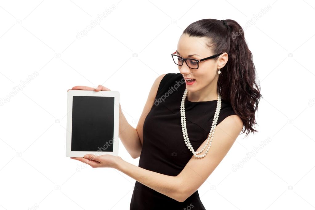 brunette girl in black dress holding ipad