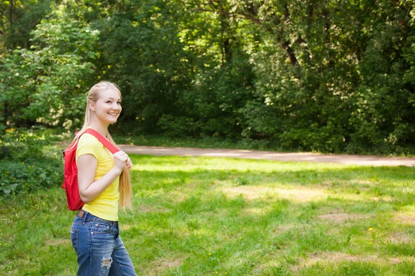 Girl with red rucksack — Stock Photo, Image