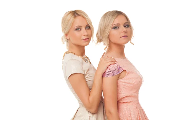 Two beautiful girls in fashion dresses isolated — Stock Photo, Image