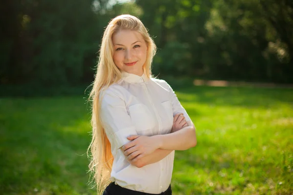 Girl out in the park with long blonde hair — Stock Photo, Image