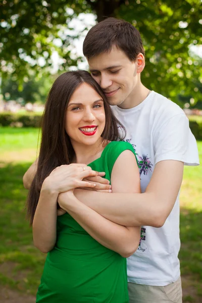 Love couple out in the park with — Stock Photo, Image