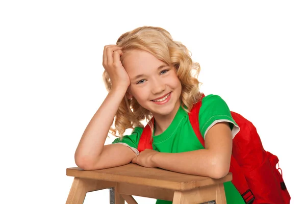 Little blonde girl in green t-shirt with red bag — Stock Photo, Image