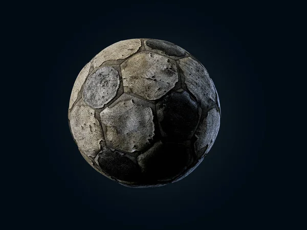 Velha bola de futebol rasgado no fundo preto — Fotografia de Stock