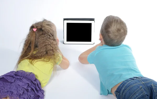 Boy and girl watching digital tablet — Stock Photo, Image
