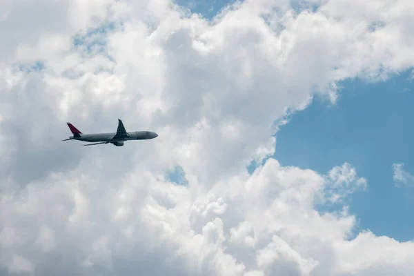 One Plane Flying Cloudy Sky — стокове фото