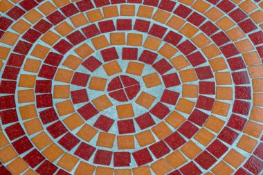 red and orange concentric ceramic tile pattern