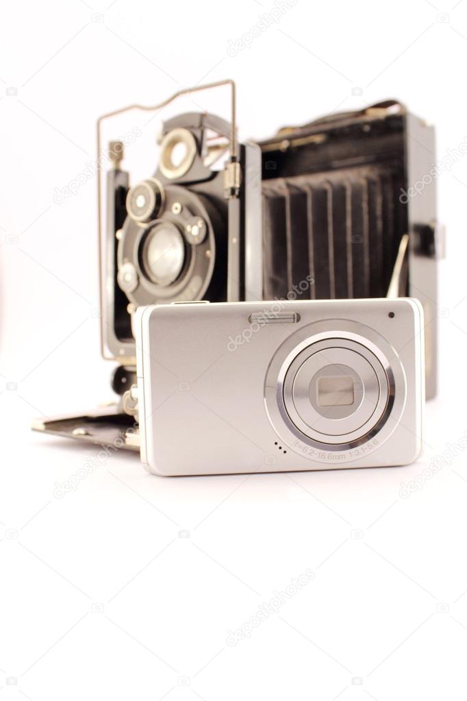 Old camera and new compact camera