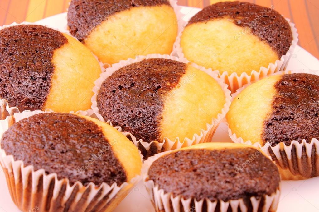 Chocolate and vanilla muffins closeup — Stock Photo © PhotoEstelar