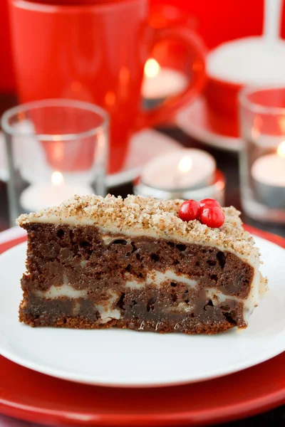 Cocolate cake with nuts on a red background. New Year's cake. — Stock Photo, Image