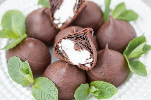 Chocolate profiteroles with cottage. — Stock Photo, Image