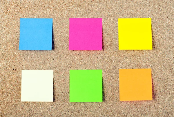 stock image Colored notes paper on a cork board