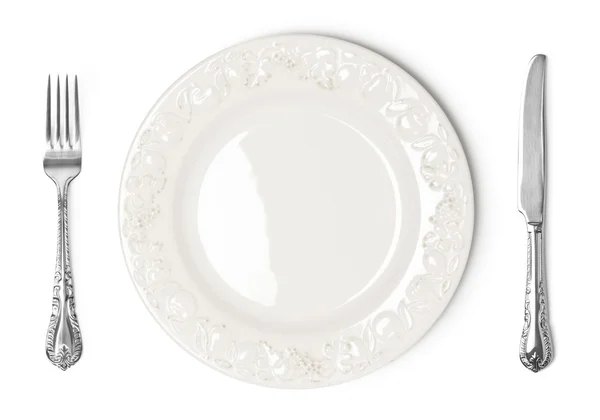 Vintage plaka, bıçak ve çatal beyaz zemin üzerine