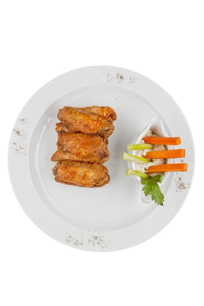 Chicken wings on the white plate — Stock Photo, Image