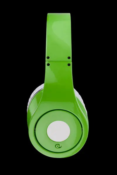 Green headphones isolated on a black background — Stock Photo, Image