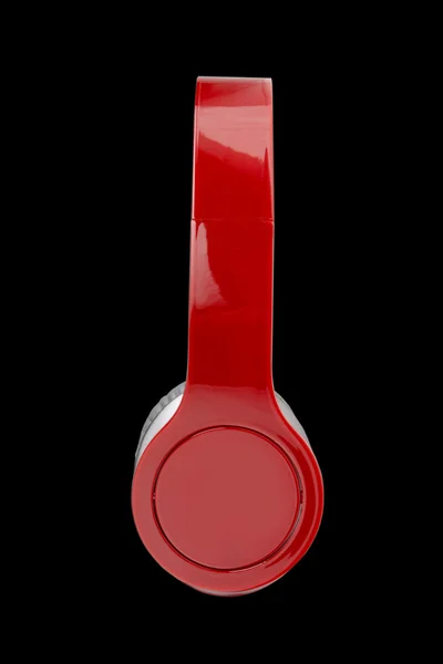 Red headphones isolated on a black background — Stock Photo, Image