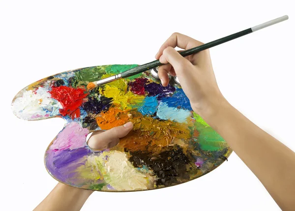 Artists hands holding a paint brush and palette — Stock Photo, Image