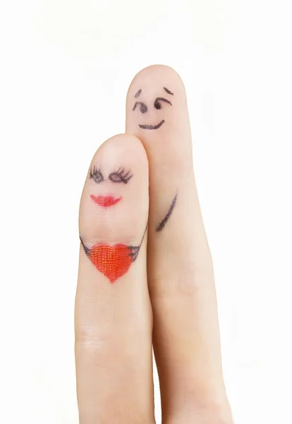 Een gelukkig paar verliefd op geschilderde smiley en knuffelen — Stockfoto