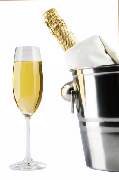 Bottle of champagne in cooler over white — Stock Photo, Image