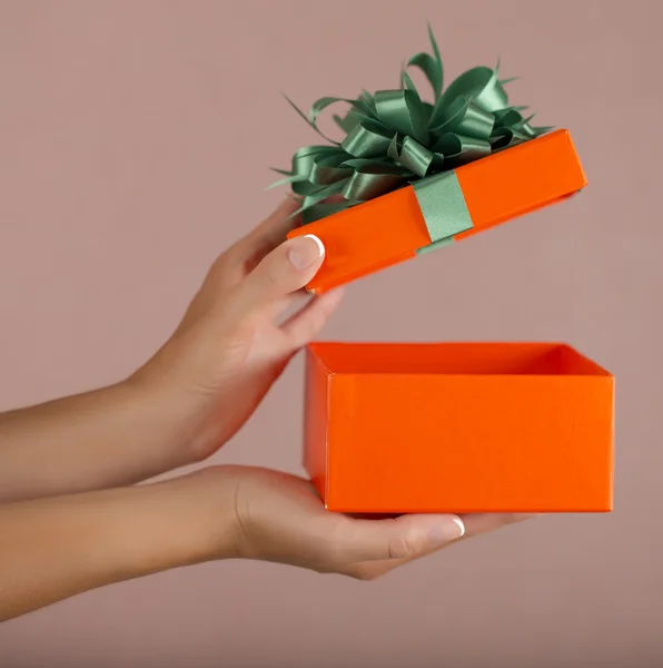 Christmas gift box with hand open — Stock Photo, Image