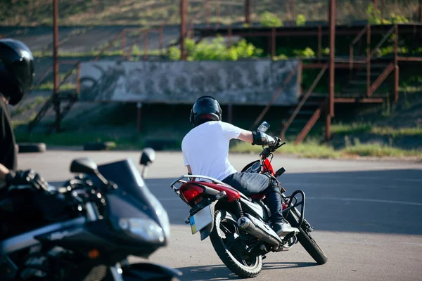 Moto school track driving. A biker on a motorcycle.