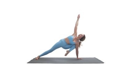 Young athletic attractive woman practicing yoga isolated on whit