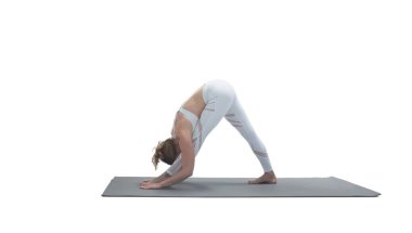 Young athletic attractive woman practicing yoga isolated on whit