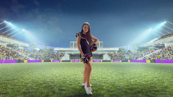 Beautiful cheerleader in action on stadium in night