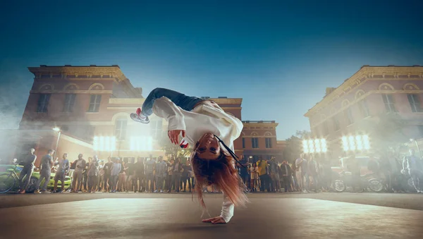 Street dancer girl  dance breakdance on evening street