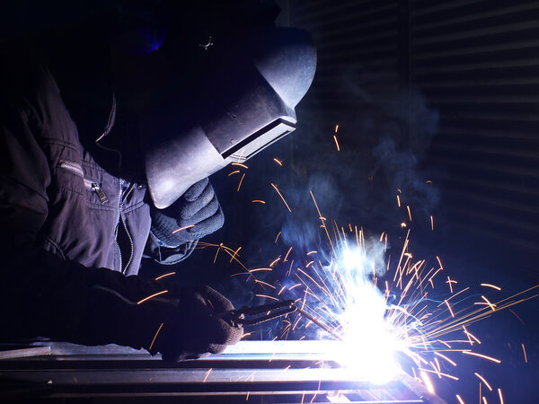 Welding and bright sparks. Hard job