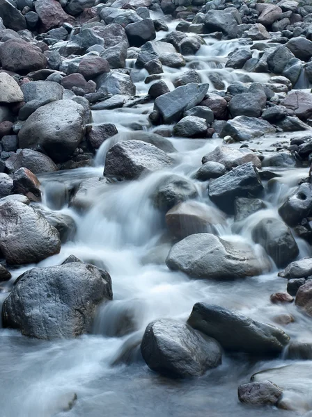 Fast river flow and dark stones. — Stock Photo, Image