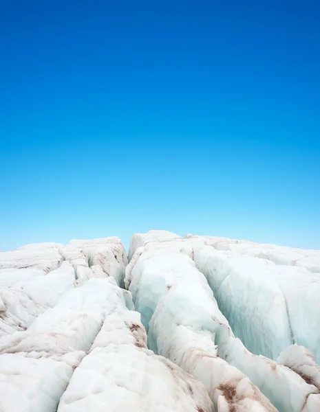 Clean ice on background blue sky. — Stock Photo, Image