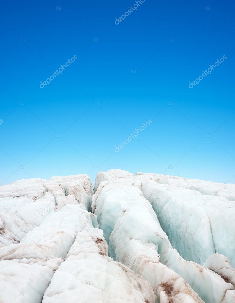 Clean ice on background blue sky.