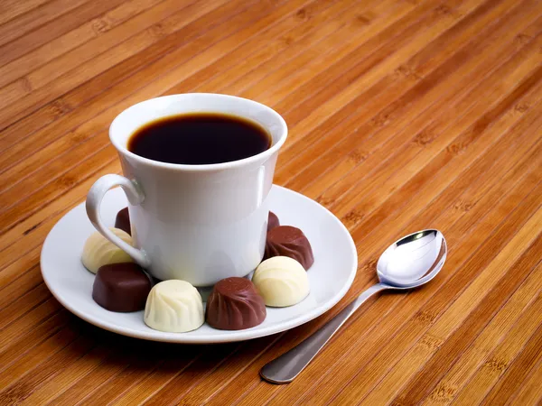 Cup with coffee and sweetmeat. — Stock Photo, Image